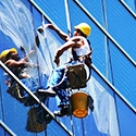 A man cleaning a window.