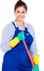 Woman with a broom smiling.